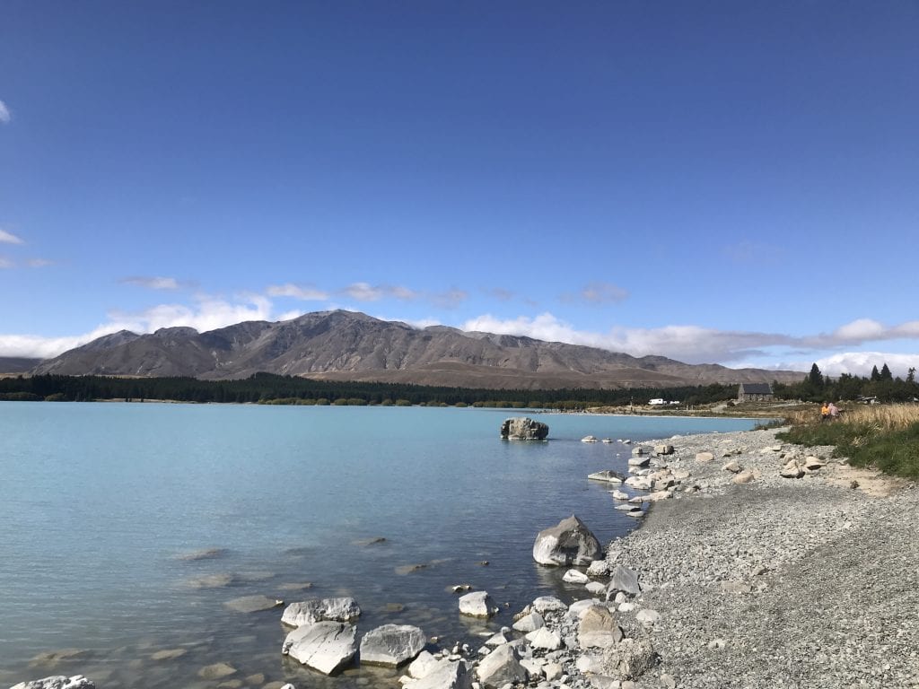 a photo from the waters edge in Lake Tekapo in the Canterbury region new zealand