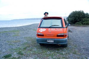a photo of me sticking my head out of one of my favourite Cheap New Zealand campervan hire with spaceships rentals