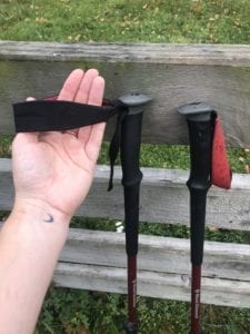 This photo shows the hand strap attached to hiking poles and where to place your hands.