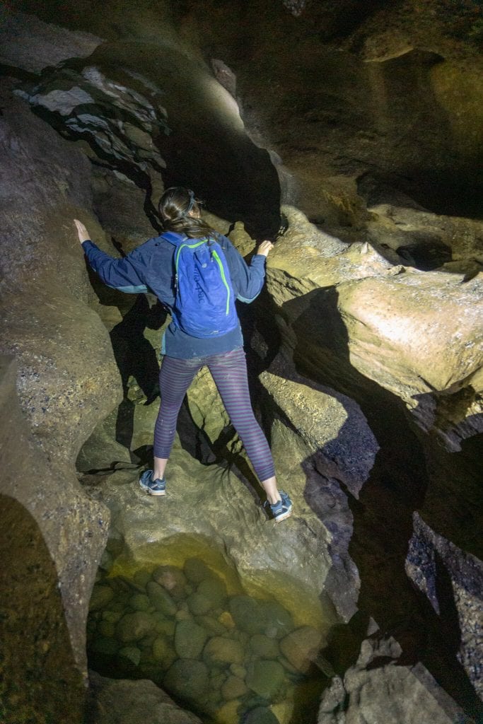a photo of alice in cliften caves one of the most underrated things to do in southland 