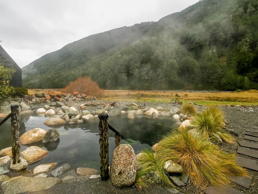 a beautiful photo of the maruia hot springs a must stop while travelling new zealand in a campervan! 